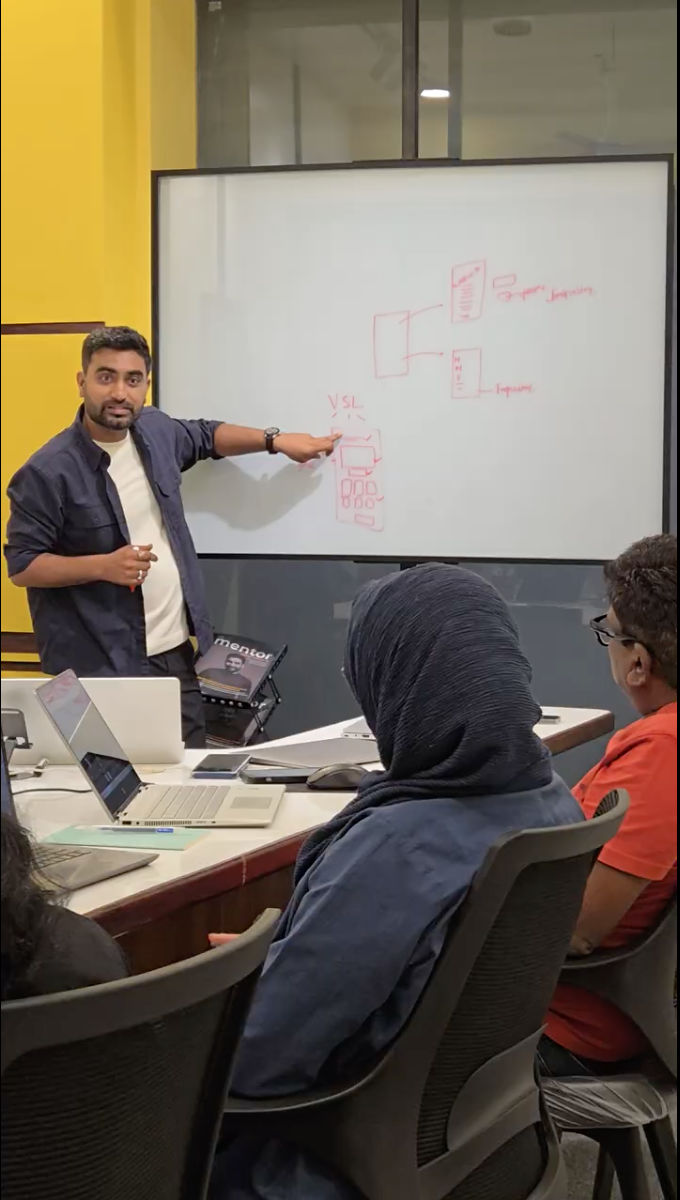 Giriraj presenting a video sales letter funnel drawn on a whiteboard